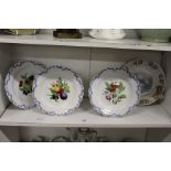 A set of three continental fruit decorated cabinet plates together with another plate.