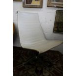 Charles Eames, a cream leather upholstered swivel side chair.