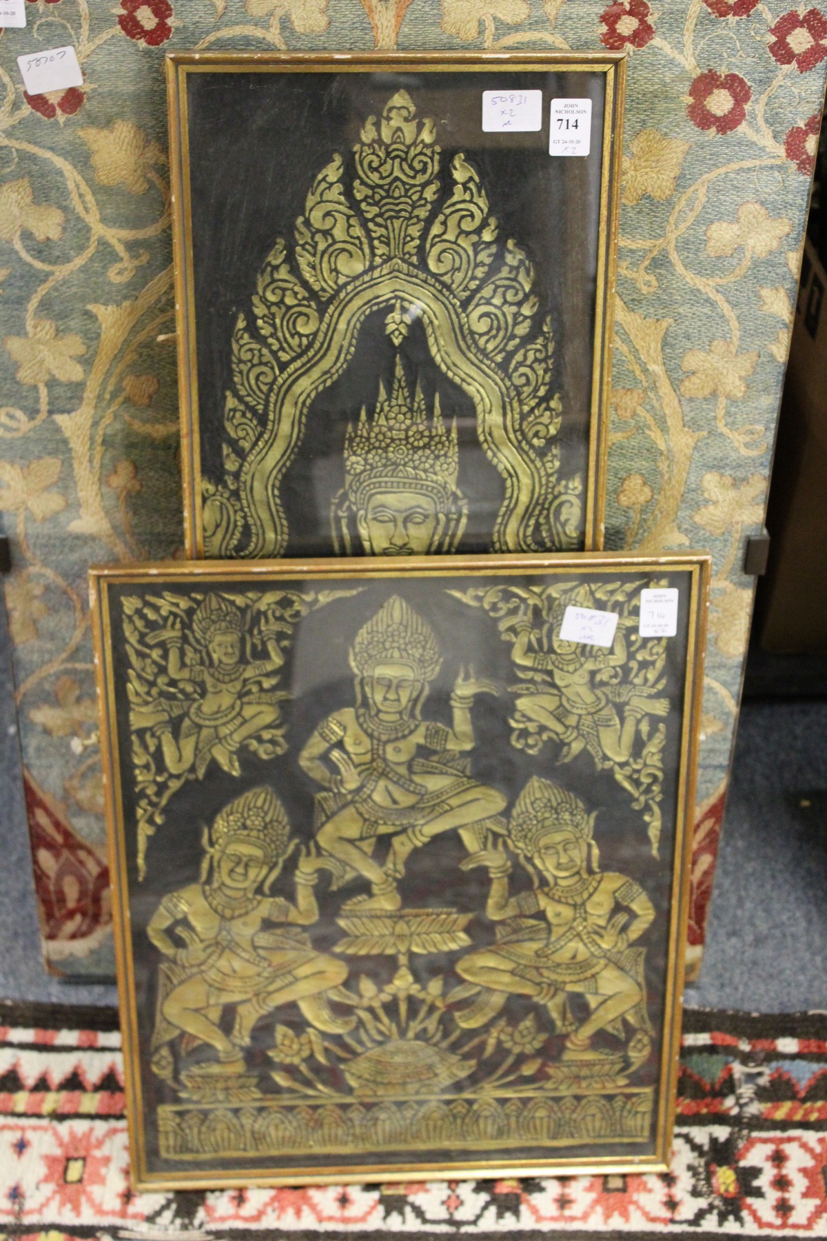 Two temple rubbings from Angkor Wat, Cambodia, framed and glazed.