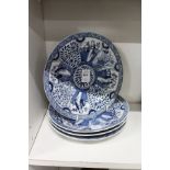 A set of four Chinese blue and white plates.