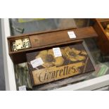 A box of old ebony and bone dominoes together with a poker work cigarette box.