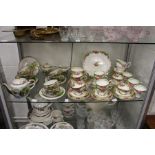 A large quantity of Paragon Tapestry Rose tea ware, together with a Japanese eggshell tea service.