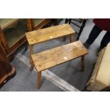 A pair of small pine benches.