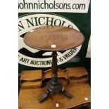 A mahogany circular occasional table.