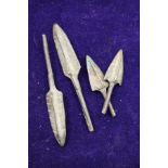 A group of four early bronze spear or arrow tips.