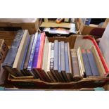 A box of art and antique reference books.
