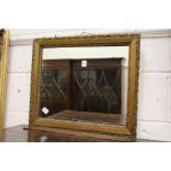 A small gilt framed mirror.