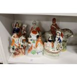 Staffordshire flatback figures and a spill vase depicting Red Riding Hood and others.