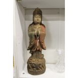 A Chinese carved and painted wood figure of standing deity.