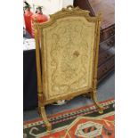 A French gilt framed fire screen.