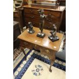 A George III mahogany lowboy with three drawers on cabriole legs with pointed pad feet.