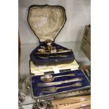 Two cased silver christening sets.