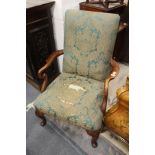 A George III style mahogany framed open armchair on cabriole legs.