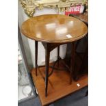 An Edwardian inlaid mahogany occasional table.