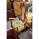 A good 17th century style "Carolean" walnut armchair with carved decoration.