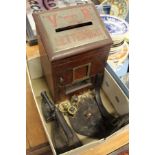 A Victorian letter box, horse brasses and flat irons.