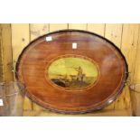 An inlaid mahogany oval twin handled tray.