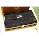 A Giorgio Armani black velvet evening bag, boxed.