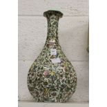 Two Royal Doulton Persian ware baluster shaped vases.