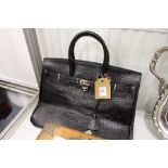 A good ladies' black leather handbag.