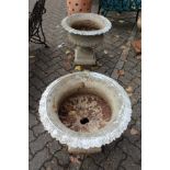 A good pair of painted cast iron classical shaped urns on pedestal bases.