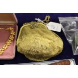 A gilt metal mesh style evening bag and a small group of bijouterie.
