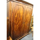 A Victorian mahogany two door wardrobe.