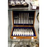 A cased set of eighteen mother-of-pearl handled fruit knives and forks (lacking one knife).