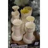 A collection of Belleek vases.