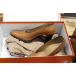 A pair of ladies' Hermes brown leather shoes, size 37, boxed.