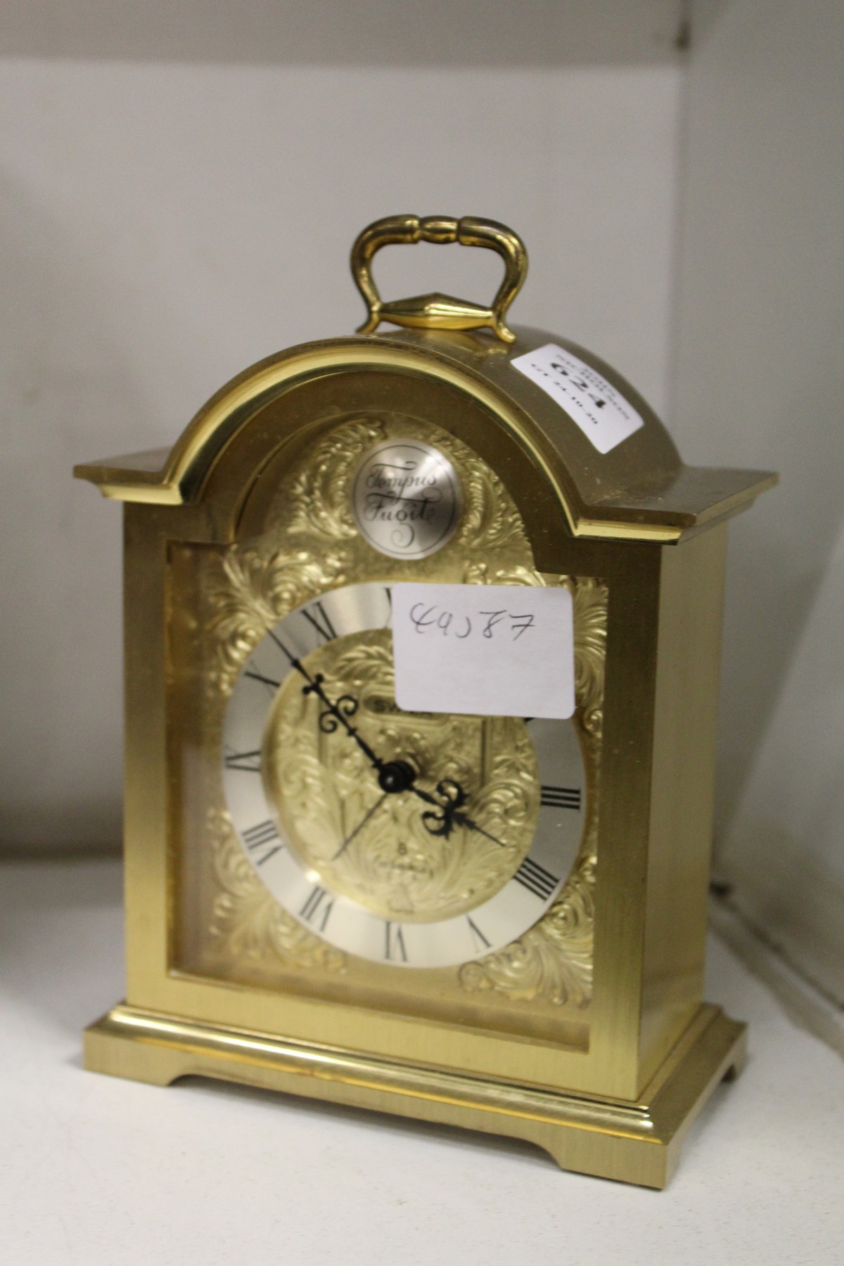 A Swiza brass mantle clock.