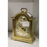 A Swiza brass mantle clock.