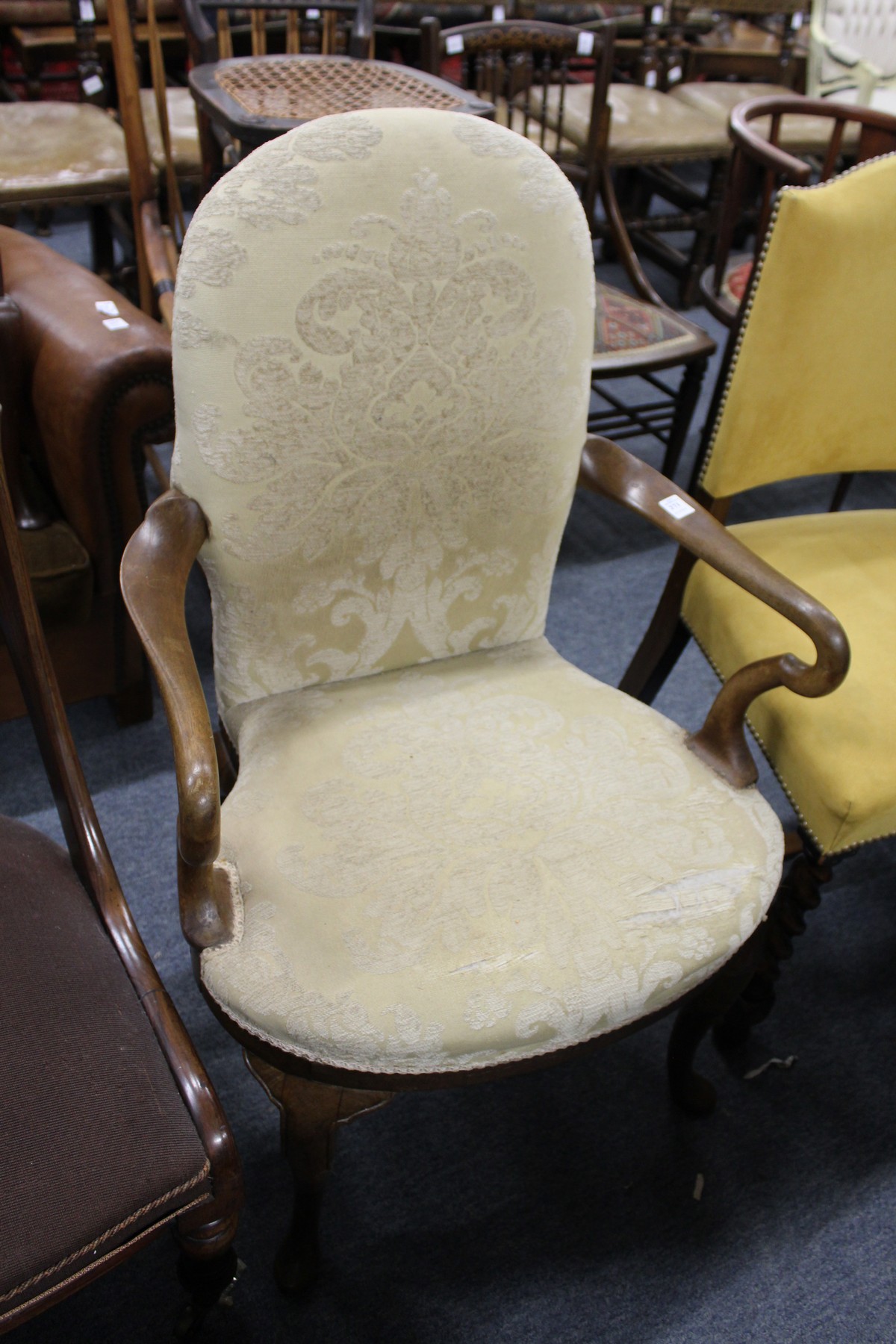 A George II style mahogany framed small open armchair with cabriole legs.