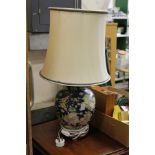 A Chinese pottery table lamp.