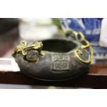 A small Chinese bronze censer with kylin handles.