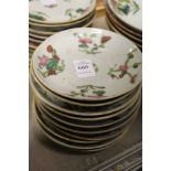 Ten small Chinese floral decorated saucers.