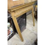 Decorative carved pine fire surround.