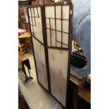 An oriental style folding dressing screen.