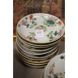 Ten small Chinese floral decorated saucers.