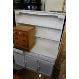 A white painted pine dresser.