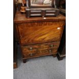 A 19th century mahogany commode with a single door and two drawers.