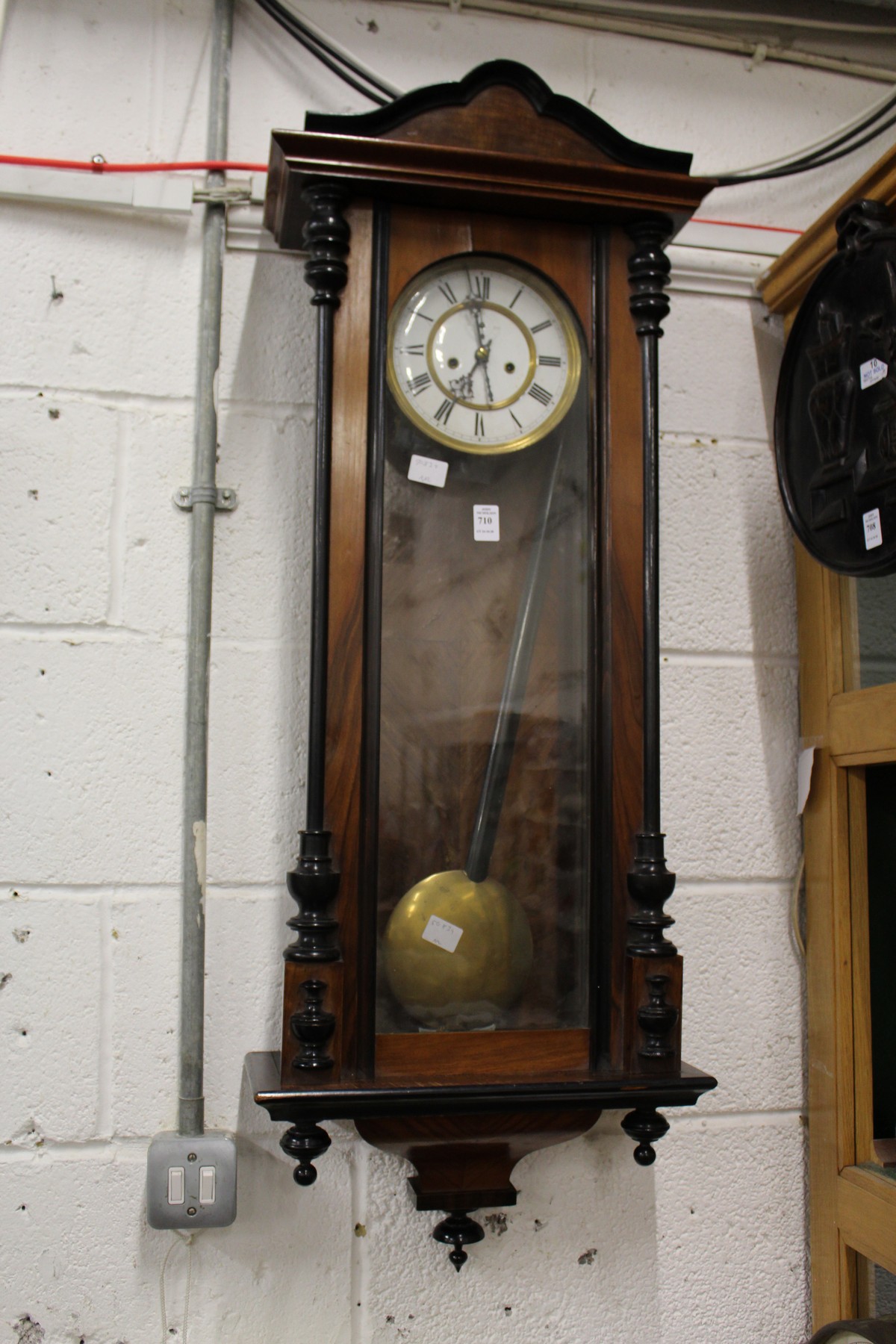 A good Victorian walnut cased Vienna style wall clock.