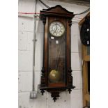 A good Victorian walnut cased Vienna style wall clock.