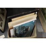 A photographic print of a lorry, two other prints and various frames.