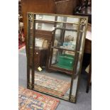 A decorative metal framed wall mirror.