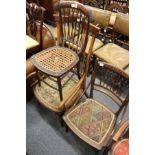 An Edwardian inlaid mahogany occasional chair and two other chairs.