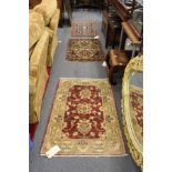Three small Persian rugs.