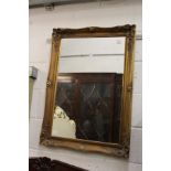 A modern gilt framed mirror.