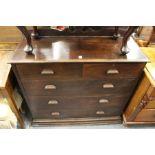 A mahogany chest of drawers.