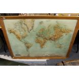 A large relief moulded map of the world.